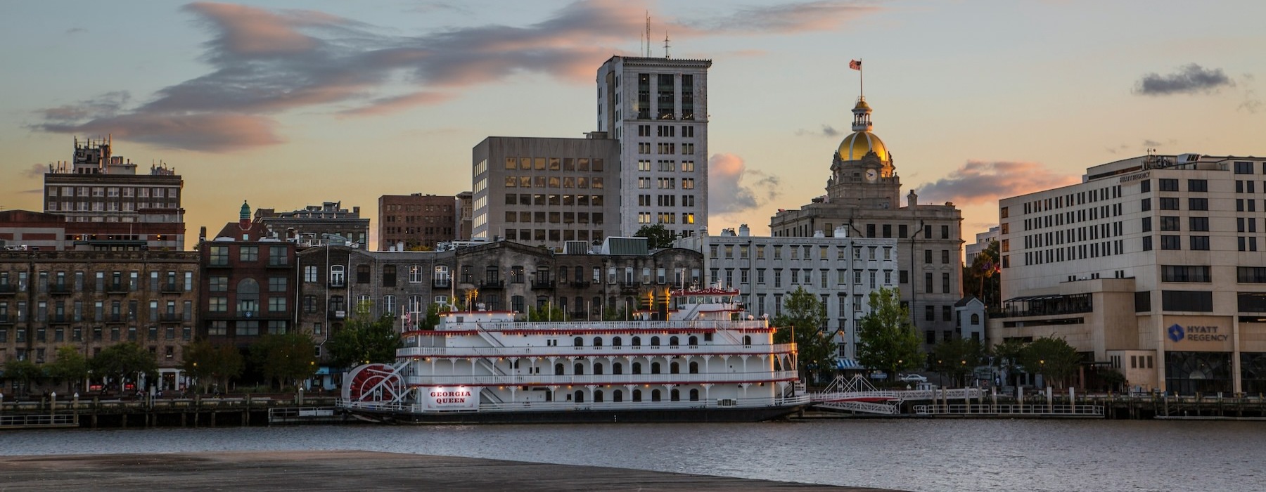 city view at dusk with a boat 