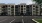 a building with many windows and a parking lot